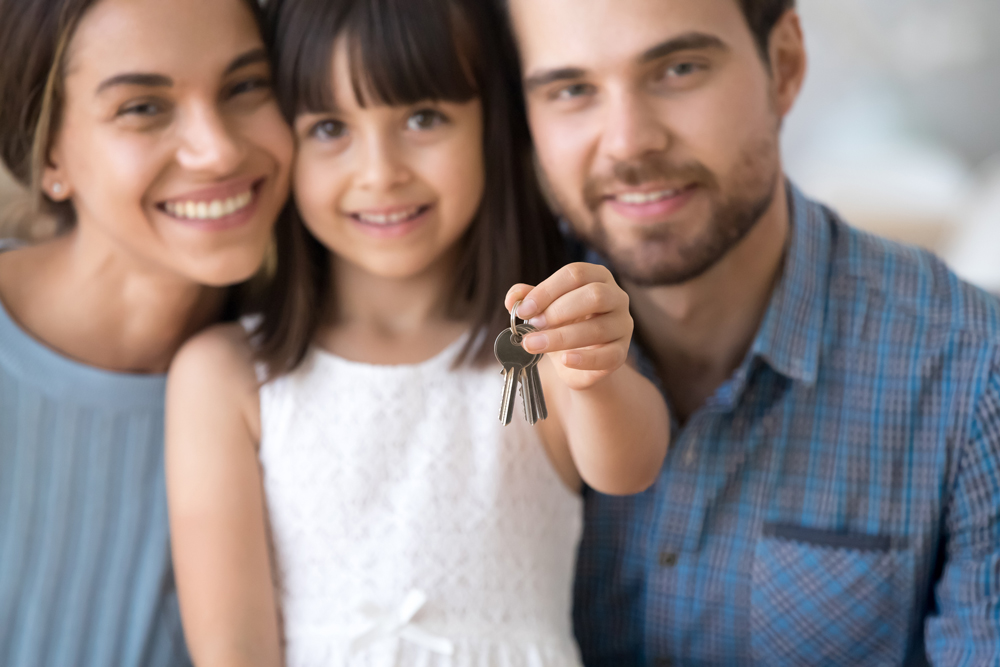 FHA LOANS - Family obtaining an FHA mortgage home loan to buy their first home